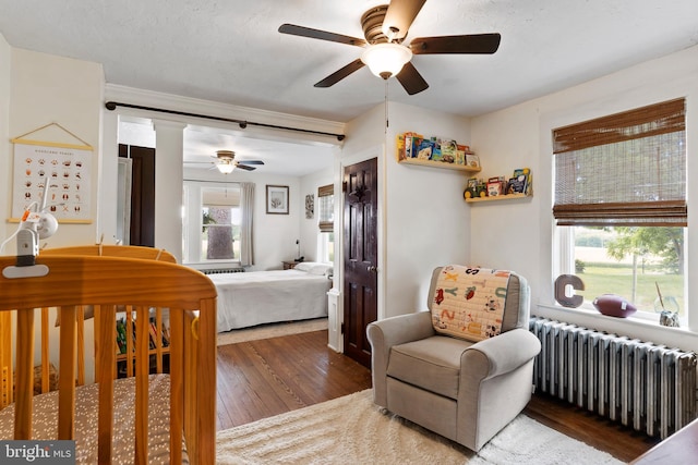 3645 N Susquehanna Trl, York, PA 17404 - bedroom featuring radiator, wood finished floors, and a ceiling fan