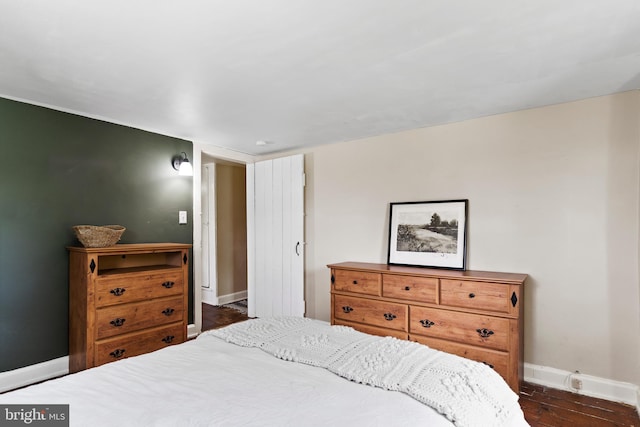 3645 N Susquehanna Trl, York, PA 17404 - bedroom with baseboards and dark wood-type flooring