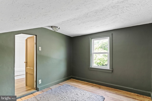 3645 N Susquehanna Trl, York, PA 17404 - spare room featuring a textured ceiling, wood finished floors, and baseboards