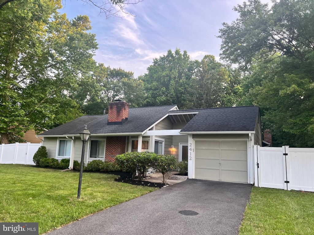 2412 Panther Ln, Bowie, MD 20716 - single story home with a garage, a gate, a chimney, driveway, and roof with shingles