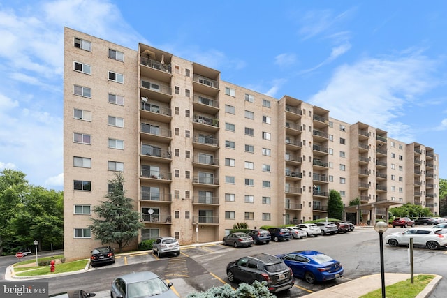 12001 Old Columbia Pike Unit 709, Silver Spring, MD 20904 - view of apartment building / complex featuring uncovered parking