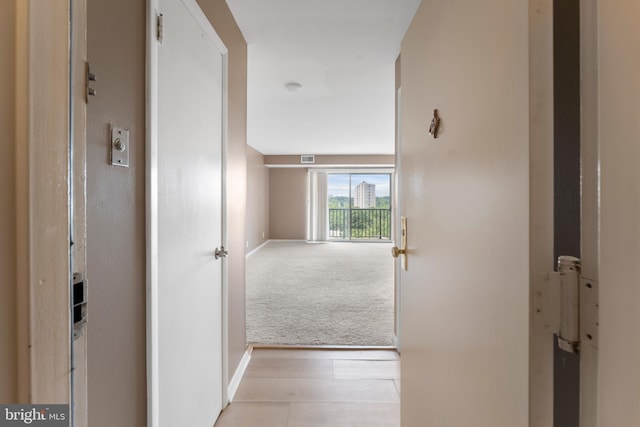 12001 Old Columbia Pike Unit 709, Silver Spring, MD 20904 - hallway with baseboards and light colored carpet