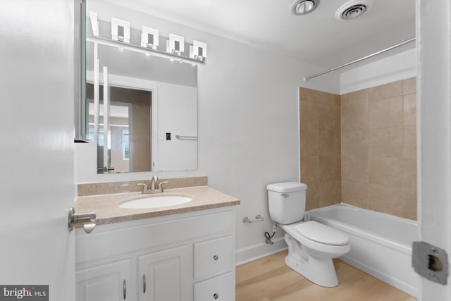 12001 Old Columbia Pike Unit 709, Silver Spring, MD 20904 - bathroom featuring toilet, vanity, bathing tub / shower combination, and wood finished floors