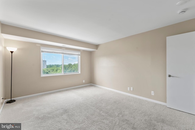 12001 Old Columbia Pike Unit 709, Silver Spring, MD 20904 - spare room featuring carpet floors, baseboards, and a smoke detector