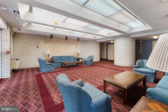 12001 Old Columbia Pike Unit 709, Silver Spring, MD 20904 - building lobby featuring brick wall, a textured ceiling, and a security system