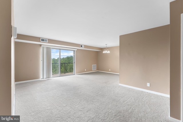 12001 Old Columbia Pike Unit 709, Silver Spring, MD 20904 - empty room featuring carpet, baseboards, and a chandelier