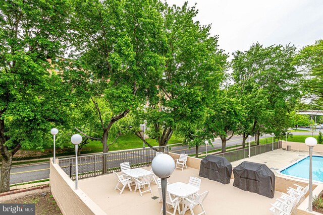 1300 Army Navy Dr S Unit 227, Arlington, VA 22202 - view of patio / terrace featuring area for grilling and outdoor dining space