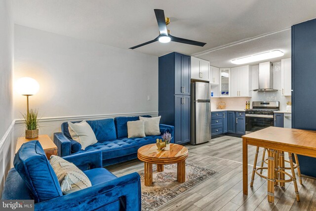 1300 Army Navy Dr S Unit 227, Arlington, VA 22202 - living room featuring a ceiling fan and light wood-type flooring