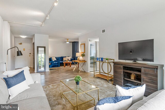 1300 Army Navy Dr S Unit 227, Arlington, VA 22202 - living area featuring wood finished floors, a ceiling fan, and rail lighting