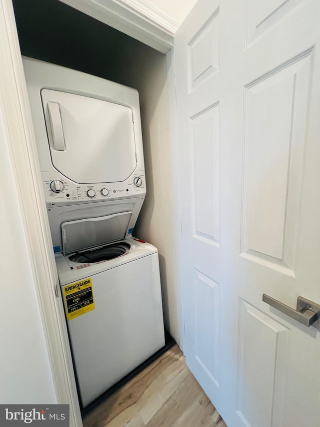 2303 Oakmont St, Philadelphia, PA 19152 - laundry room with stacked washer / drying machine and light wood-style flooring