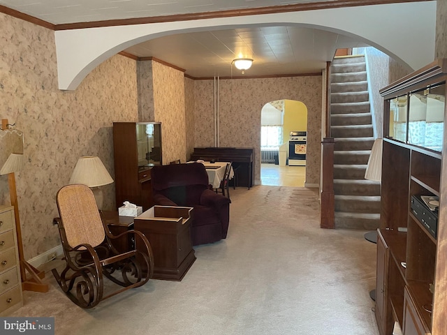1215 Cleveland St, Baltimore, MD 21230 - carpeted living area with arched walkways, wallpapered walls, ornamental molding, stairway, and baseboards