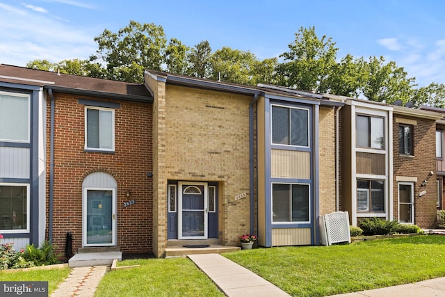 2825 Cambridge Dr, Woodbridge, VA 22192 - view of property featuring brick siding and a front lawn