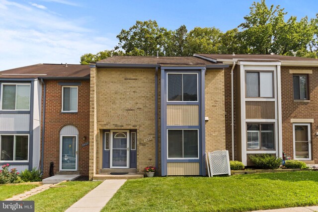 2825 Cambridge Dr, Woodbridge, VA 22192 - multi unit property featuring a front lawn and brick siding