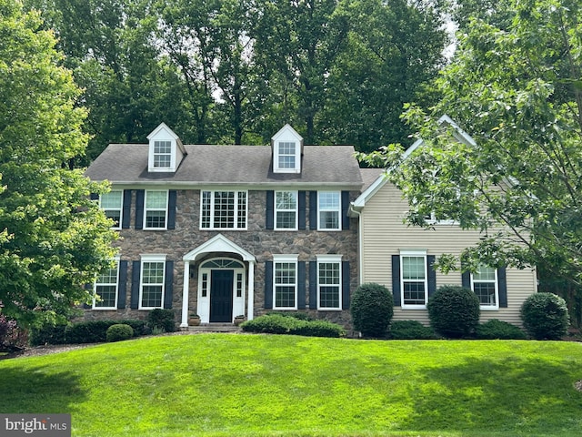25 Baldwin Cir, Glenmoore, PA 19343 - colonial-style house featuring stone siding and a front lawn