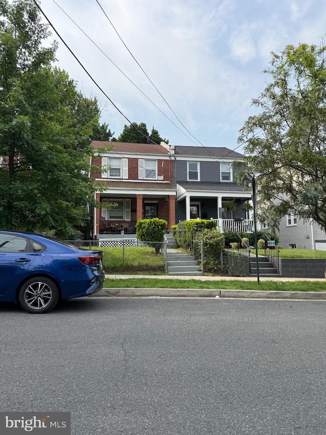 1109 Congress St SE, Washington, DC 20032 - view of front of house with a porch and brick siding