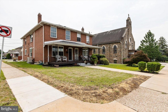 464 Fairfield Rd, Plymouth Meeting, PA 19462 - view of front of home with a porch, a front yard, a chimney, and brick siding