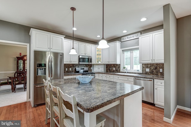 66 Light Farm Dr, Cochranville, PA 19330 - kitchen featuring appliances with stainless steel finishes, light wood-type flooring, white cabinetry, and recessed lighting