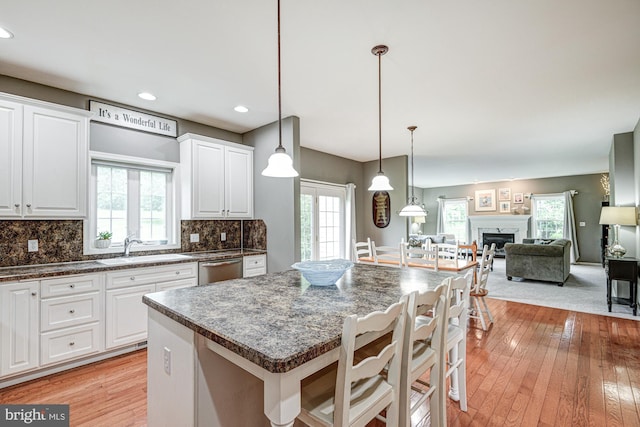 66 Light Farm Dr, Cochranville, PA 19330 - kitchen featuring healthy amount of natural light, light wood finished floors, white cabinets, and recessed lighting