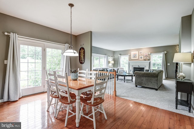 66 Light Farm Dr, Cochranville, PA 19330 - dining area with light wood-type flooring and a fireplace