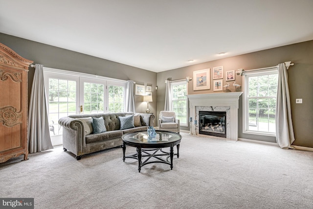 66 Light Farm Dr, Cochranville, PA 19330 - carpeted living room with a high end fireplace