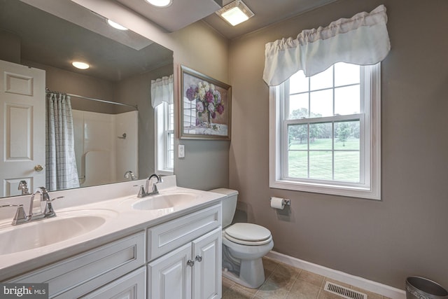 66 Light Farm Dr, Cochranville, PA 19330 - full bath with plenty of natural light, a shower with shower curtain, double vanity, and tile patterned flooring