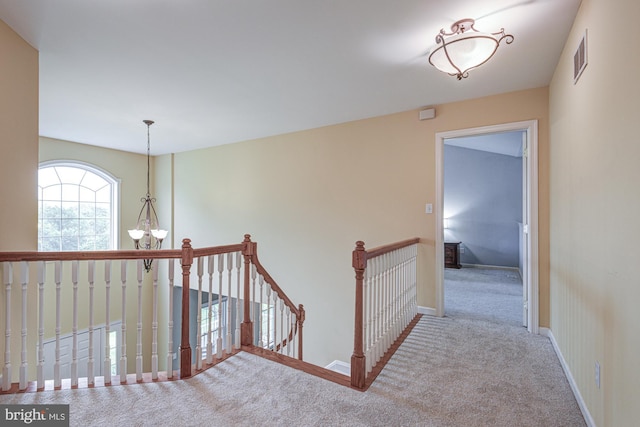 66 Light Farm Dr, Cochranville, PA 19330 - hall featuring carpet, an upstairs landing, and a chandelier