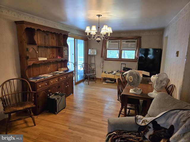 6548 Rte 209, Lykens, PA 17048 - living area featuring light wood-type flooring, a chandelier, and a wall mounted air conditioner