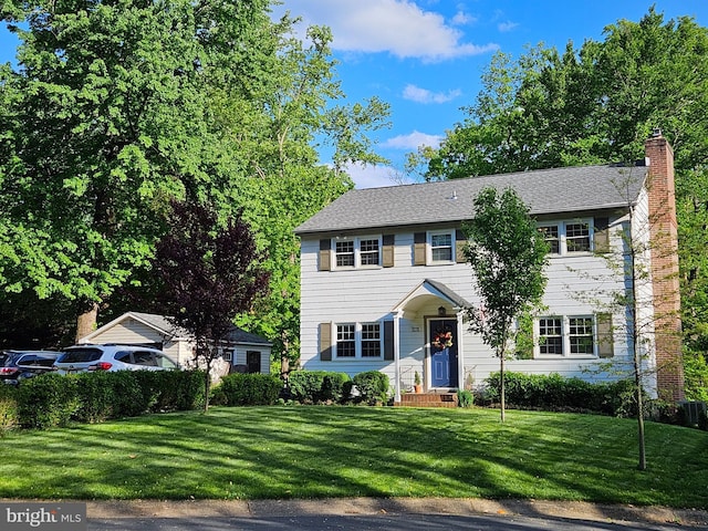 27 Cascade Rd, Arnold, MD 21012 - colonial house featuring a front yard and a chimney