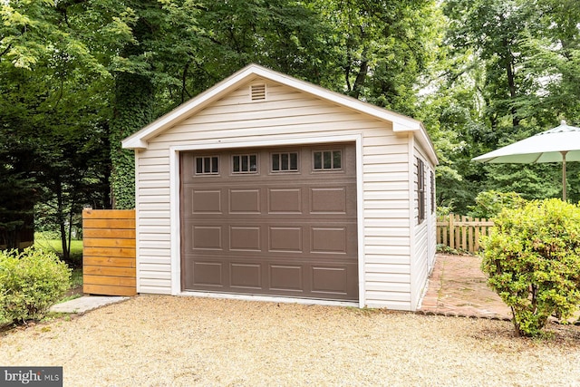 27 Cascade Rd, Arnold, MD 21012 - detached garage featuring driveway and view of wooded area