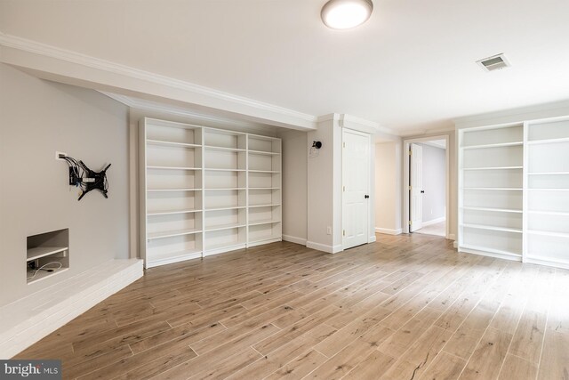 27 Cascade Rd, Arnold, MD 21012 - spare room with wood finished floors, crown molding, and built in features