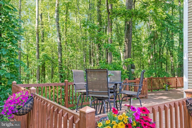 6943 Deer Run Dr, Alexandria, VA 22306 - deck with outdoor dining space and a forest view