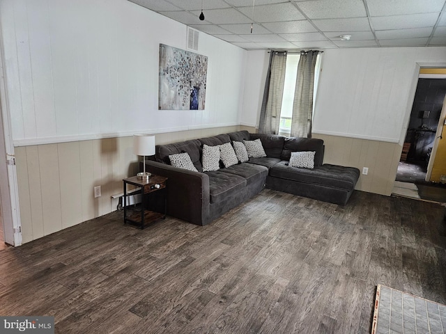 116 Maple Ave, Preston, MD 21655 - living area with wood finished floors, a drop ceiling, and wooden walls