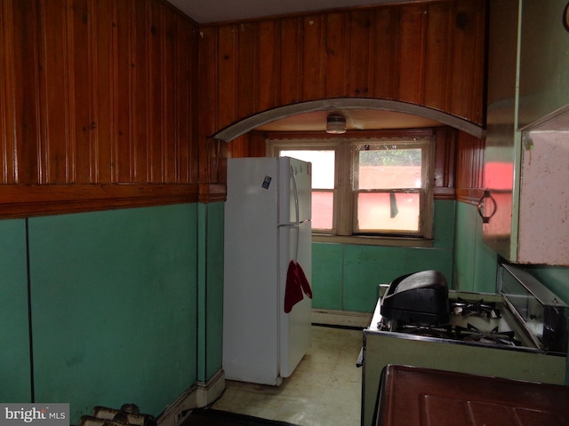 4636 Kraydor St, Philadelphia, PA 19136 - kitchen featuring white appliances, light floors, arched walkways, and baseboard heating