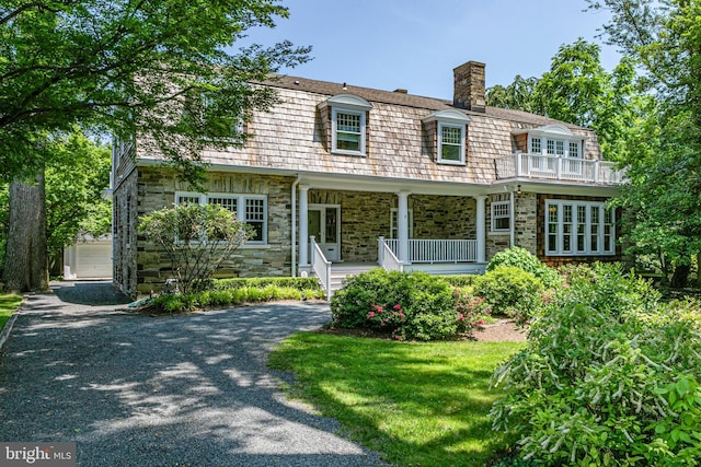 3 Evelyn Pl, Princeton, NJ 08540 - view of front of home featuring a porch, stone siding, a chimney, and driveway
