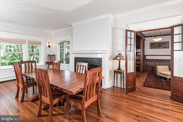3 Evelyn Pl, Princeton, NJ 08540 - dining space featuring crown molding, hardwood / wood-style floors, and a fireplace