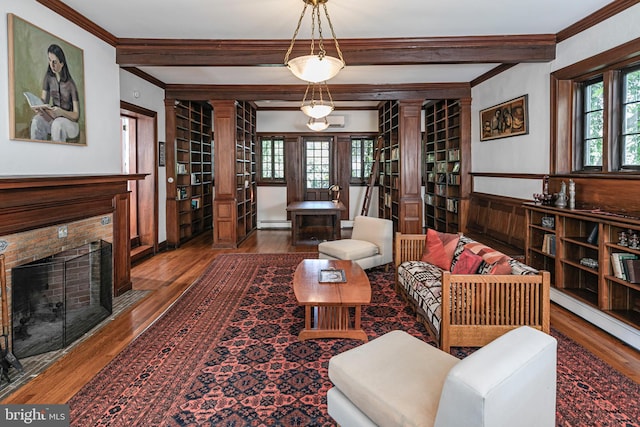 3 Evelyn Pl, Princeton, NJ 08540 - living area with decorative columns, crown molding, wood finished floors, baseboard heating, and a fireplace