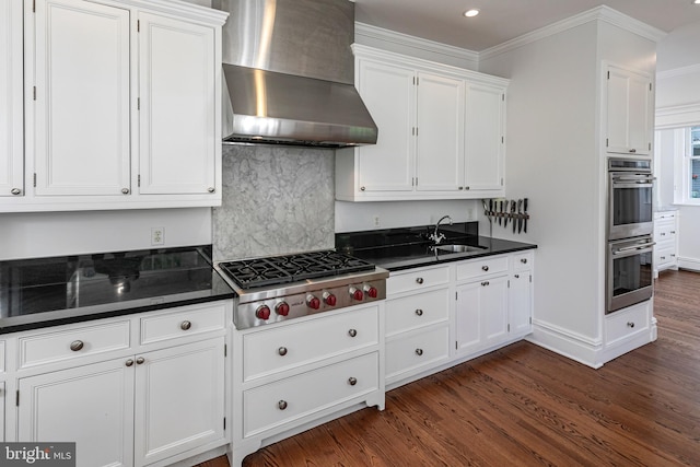3 Evelyn Pl, Princeton, NJ 08540 - kitchen with wall chimney exhaust hood, appliances with stainless steel finishes, dark countertops, white cabinets, and dark wood-type flooring