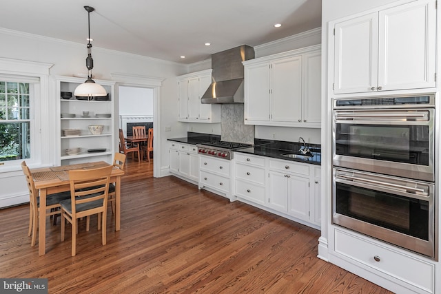 3 Evelyn Pl, Princeton, NJ 08540 - kitchen featuring appliances with stainless steel finishes, white cabinets, dark countertops, crown molding, and dark wood-style floors