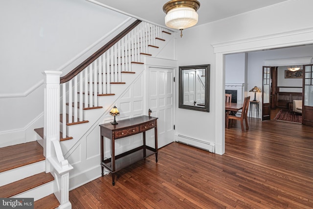3 Evelyn Pl, Princeton, NJ 08540 - foyer entrance featuring baseboard heating, stairway, hardwood / wood-style floors, a brick fireplace, and ornamental molding