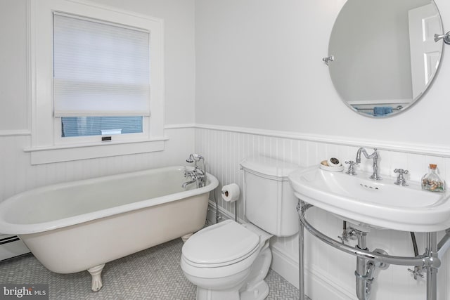 3 Evelyn Pl, Princeton, NJ 08540 - bathroom with a soaking tub, wainscoting, tile patterned flooring, and a baseboard radiator