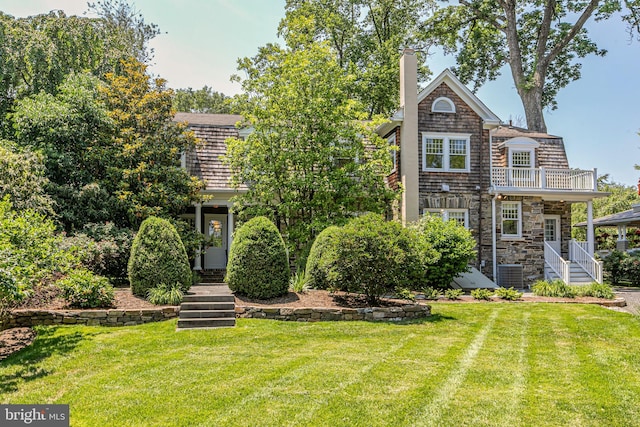3 Evelyn Pl, Princeton, NJ 08540 - view of front of home featuring a front yard, a balcony, a chimney, and stone siding