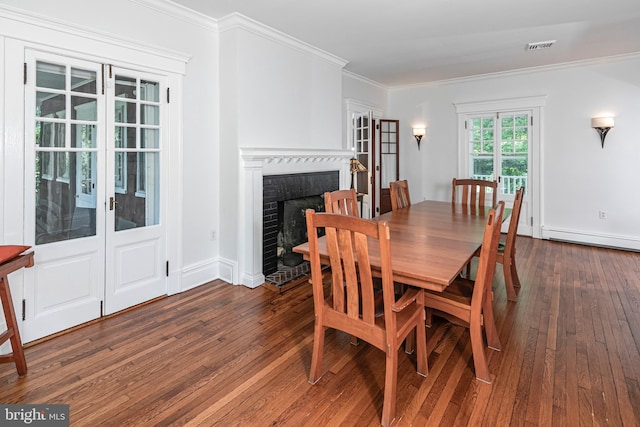 3 Evelyn Pl, Princeton, NJ 08540 - dining space featuring dark wood finished floors, crown molding, a baseboard radiator, and a fireplace