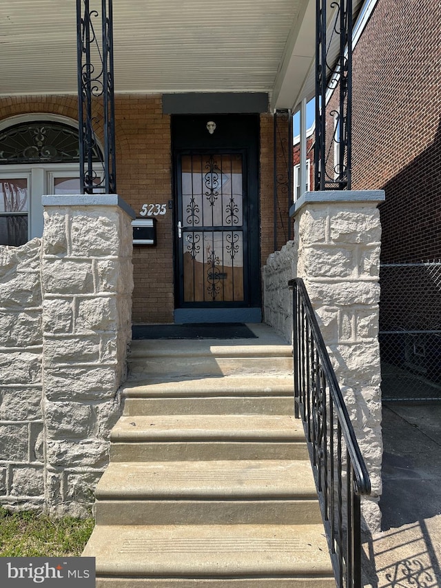 5235 Baltimore Ave, Philadelphia, PA 19143 - doorway to property with brick siding and covered porch