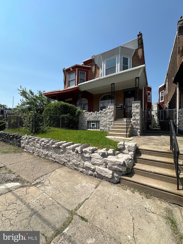 5235 Baltimore Ave, Philadelphia, PA 19143 - view of front of house featuring a porch and stairs