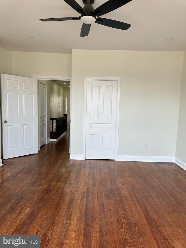 5235 Baltimore Ave, Philadelphia, PA 19143 - unfurnished bedroom featuring baseboards, dark wood-type flooring, ceiling fan, and a closet