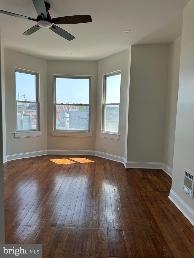 5235 Baltimore Ave, Philadelphia, PA 19143 - spare room with dark wood-type flooring, plenty of natural light, baseboards, and ceiling fan