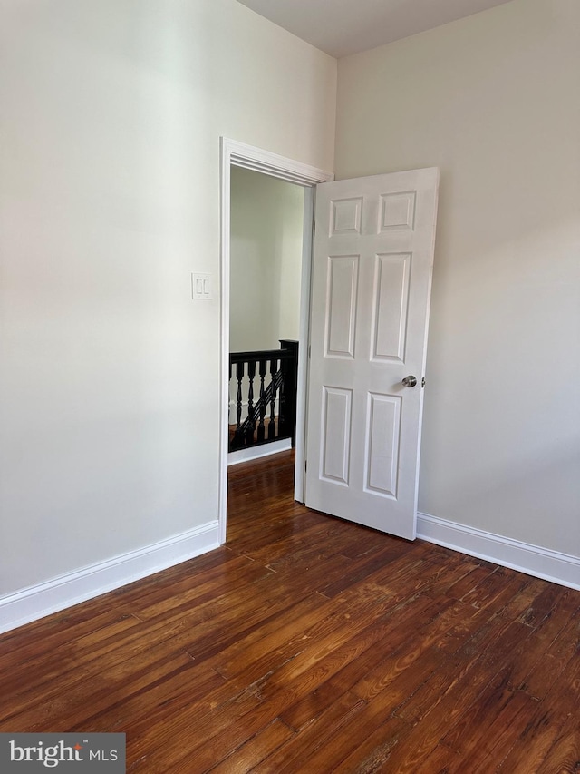 5235 Baltimore Ave, Philadelphia, PA 19143 - spare room with baseboards and dark wood-style floors