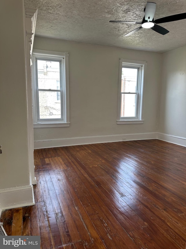 5235 Baltimore Ave, Philadelphia, PA 19143 - unfurnished room with wood-type flooring, baseboards, a ceiling fan, and a textured ceiling
