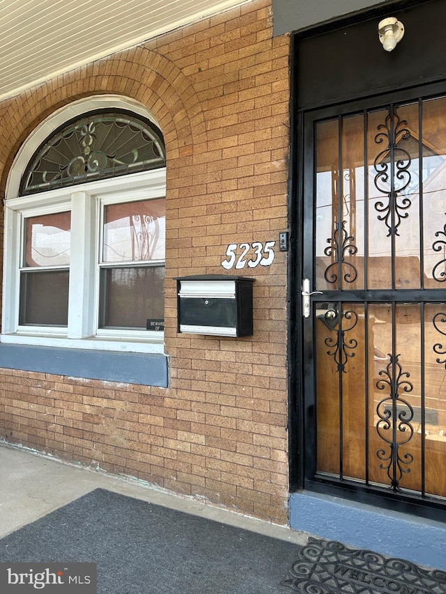 5235 Baltimore Ave, Philadelphia, PA 19143 - doorway to property featuring brick siding