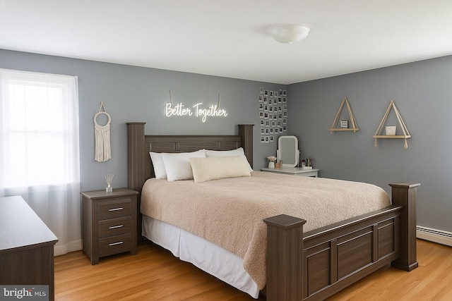 4422 Sharon Dr, Wilmington, DE 19808 - bedroom featuring light wood-style flooring and a baseboard heating unit